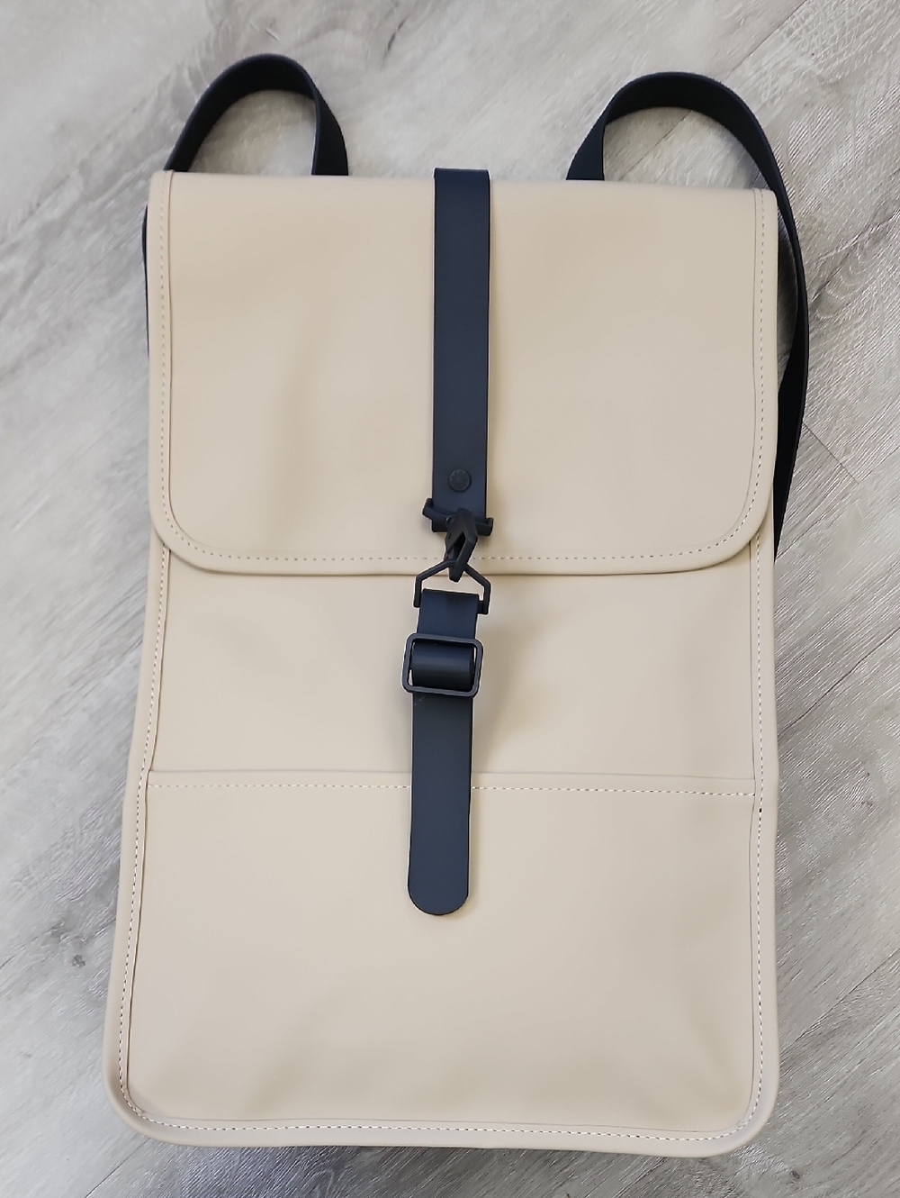 RAINS Wsterproof Cream Backpack with Black Strap